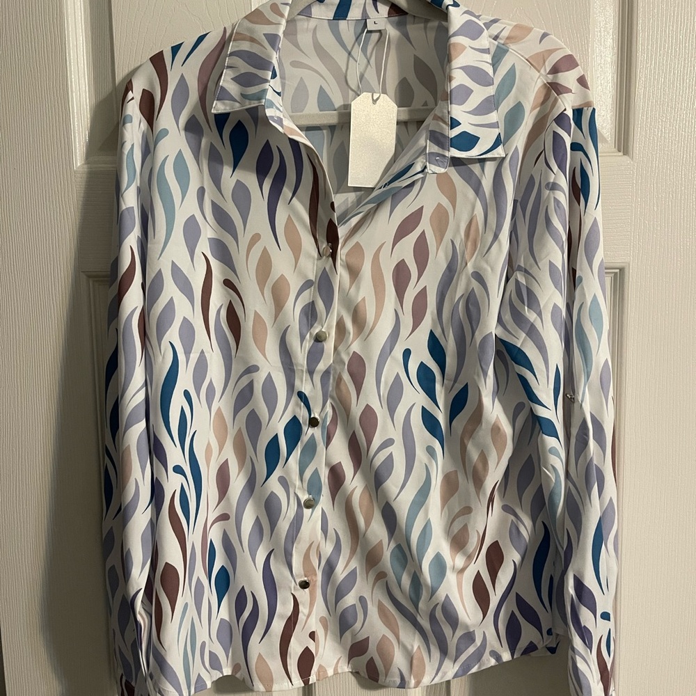 NWT beautiful soft long sleeve blouse. Botton down front.